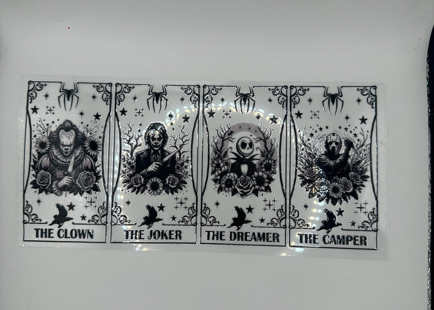 Four black and white illustrations of 'The Clown', 'The Joker', 'The Dreamer', and 'The Camper' on a white background.