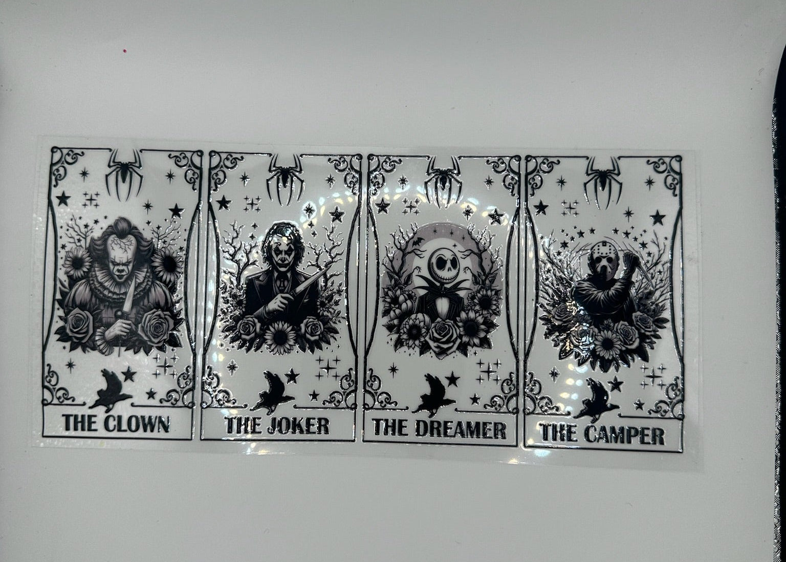 Four black and white illustrations of 'The Clown', 'The Joker', 'The Dreamer', and 'The Camper' on a white background.